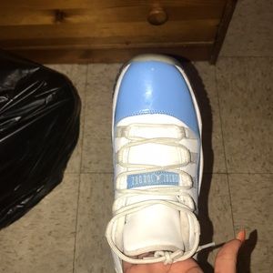 Blue and white low top Jordan 11s